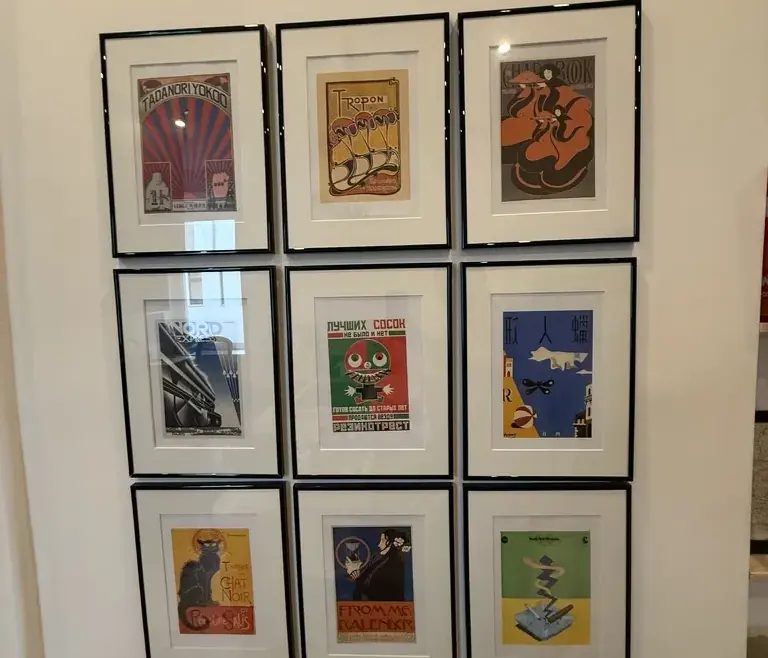 Nine framed pictures aligned in a three-by-three arrangement.